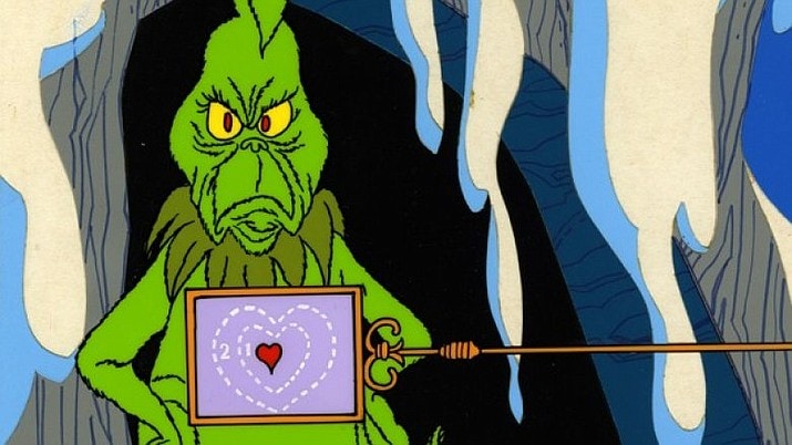 The grinch stands with an xray over his heart revealing that it is indeed 2 sizes too small because he has not yet partaken in any winter crafts.