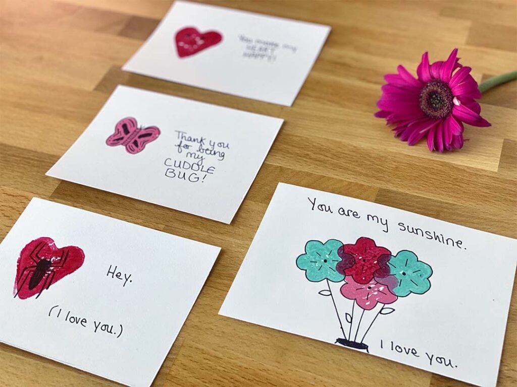 White greeting cards made with stamps and decorations