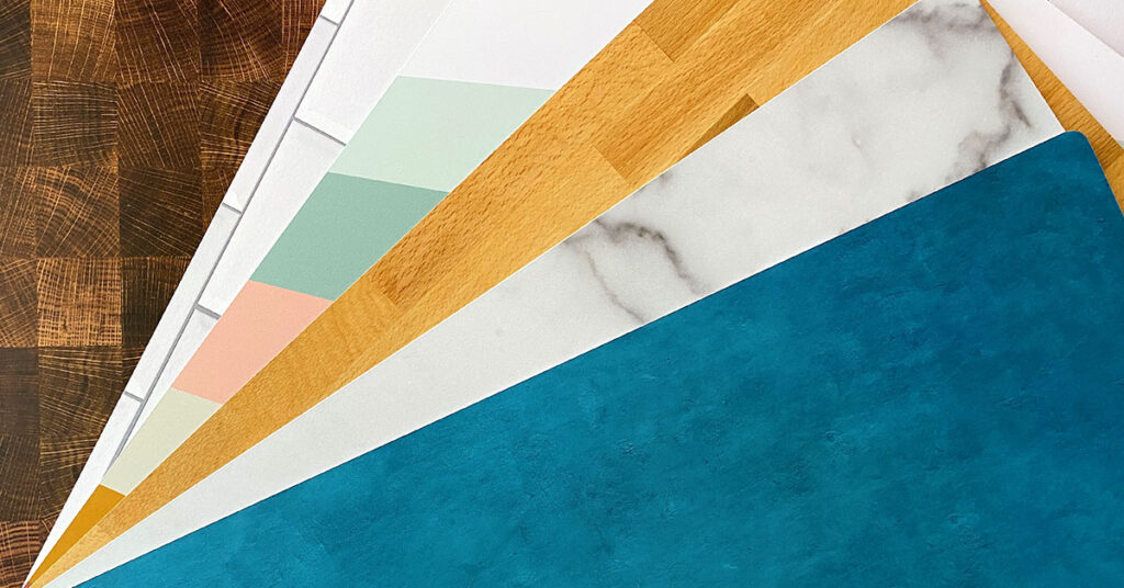 an array of replica surfaces is arranged in a fan formation varying from wood to various colored backgrounds