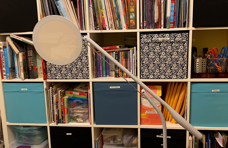 Cricut Bright 360 fully assembled in front of shelves in a craft room