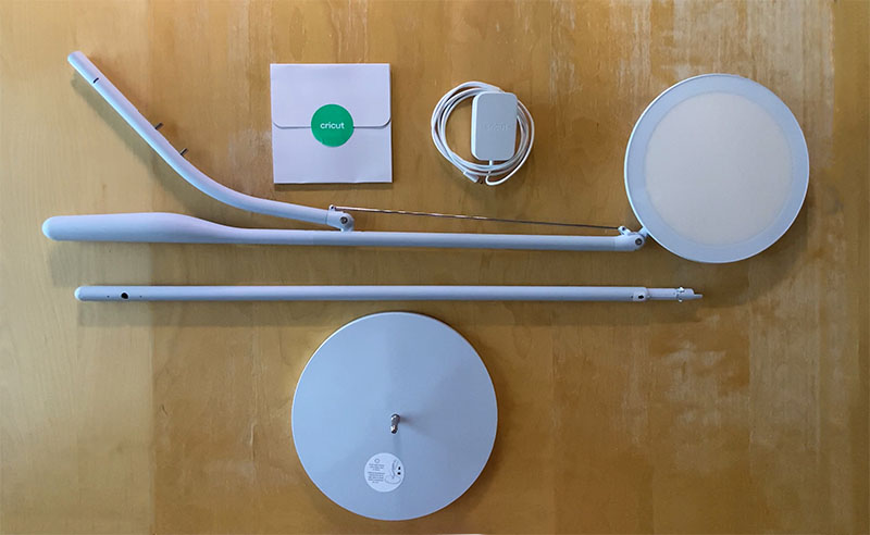 pieces of the cricut bright 360 lamp displayed outside of packaging