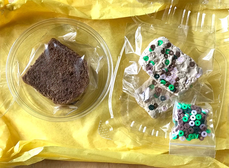chocolate chip brownie bread slime sits next to rice krispie treats slime
