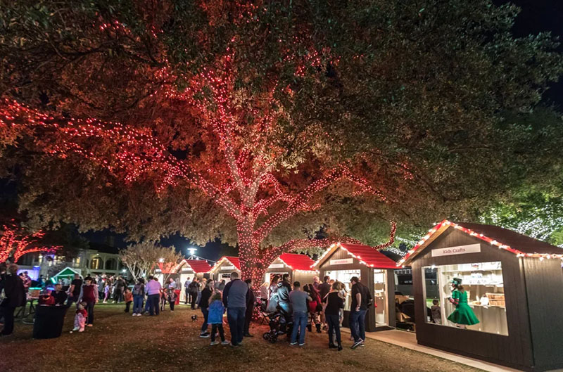 Small houses stretch across the Hilton Anatole for North Pole Texas Christmas Village